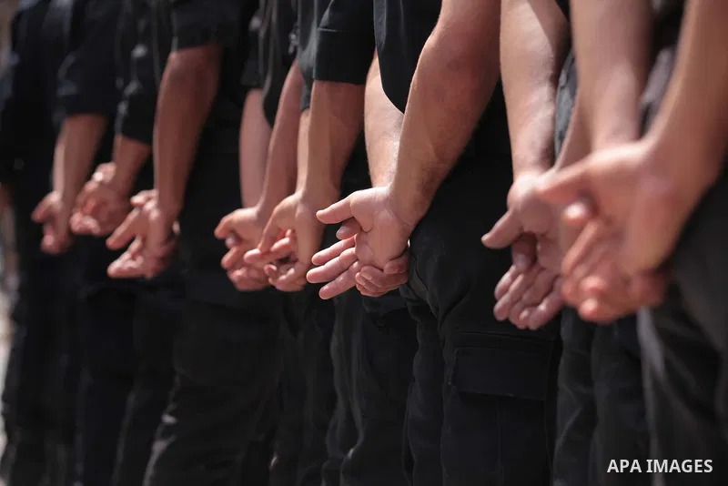 Palestinian policemen stand guard in front of the United Nations Development Programme office (UNDP), during a protest calling for the release of Palestinian prisoners from Israeli jails, in Gaza City on May 07, 2014. Ph...