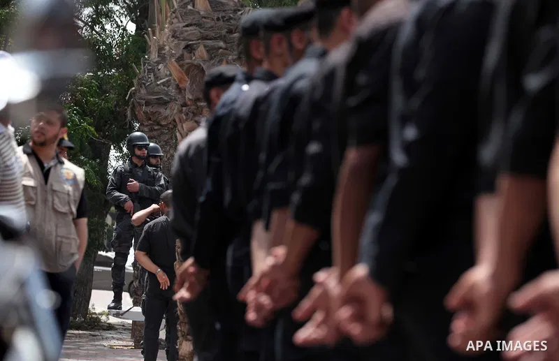Palestinian policemen stand guard in front of the United Nations Development Programme office (UNDP), during a protest calling for the release of Palestinian prisoners from Israeli jails, in Gaza City on May 07, 2014. Ph...