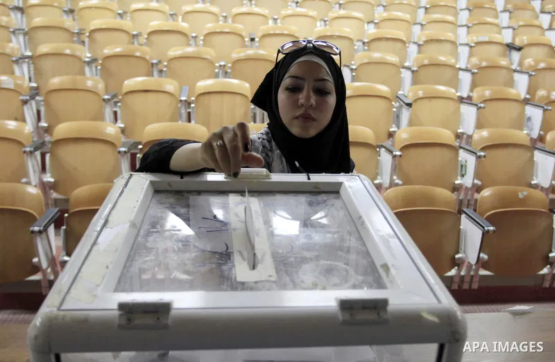 A Palestinian student of BirZeit University casts their ballots during the Student Council elections, on the outskirts of the city of Ramallah in the West Bank on May 7, 2014. The Student Council elections, will pit stud...
