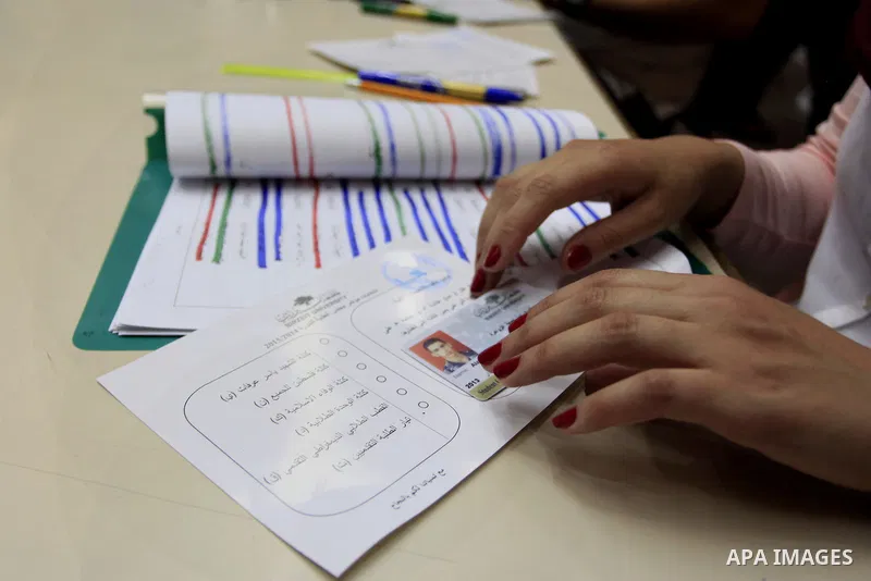 Electoral commission employees count votes during the Student Council elections at BirZeit University, on the outskirts of the city of Ramallah in the West Bank on May 7, 2014. The Student Council elections, will pit stu...