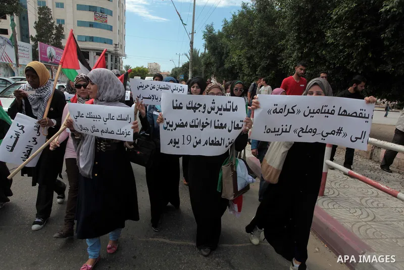 Palestinian protesters hold placards during a rally demanding the release of Palestinian prisoners on hunger strike held in Israeli jails, in Gaza City, 12 May 2014. According to reports, more than 5,000 Palestinians are...