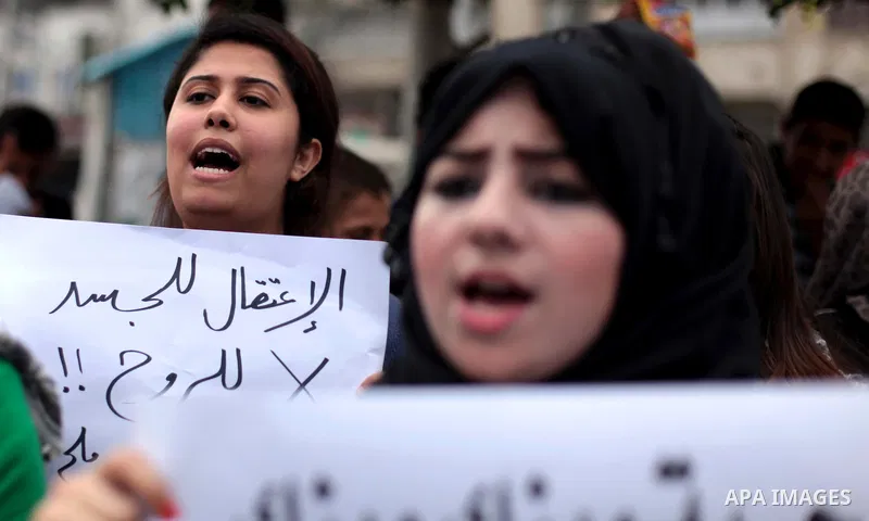 Palestinian protesters hold placards during a rally demanding the release of Palestinian prisoners on hunger strike held in Israeli jails, in Gaza City, 12 May 2014. According to reports, more than 5,000 Palestinians are...