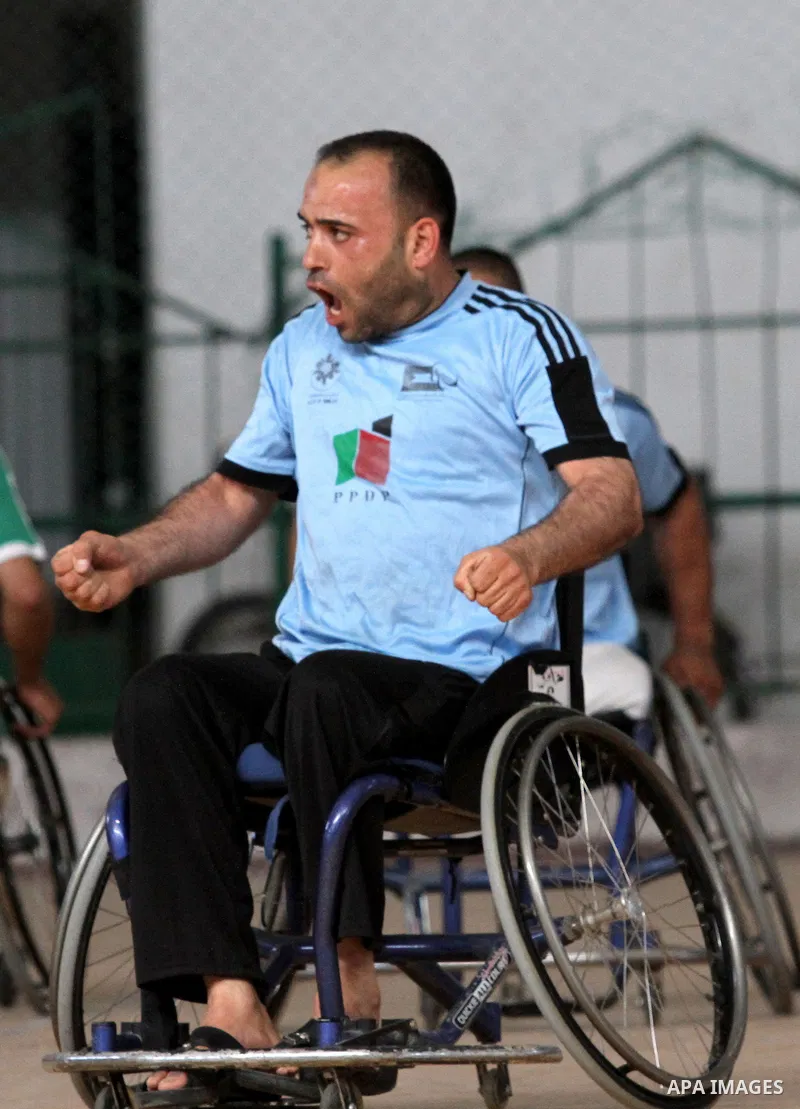 Disabled Palestinian basketball players take part in a game in Gaza City, on May 12, 2014. Photo by Alaa Shamaly
