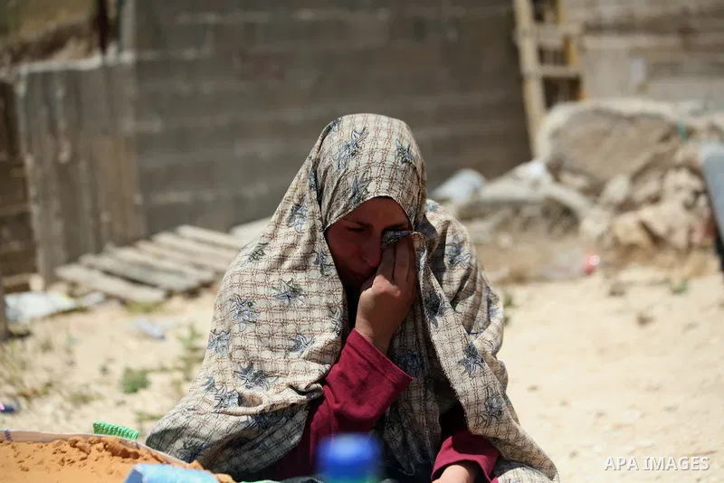 A Palestinian woman reacts after demolish her house by Israeli municipality bulldozers under the pretext of building without permit, at Jabal al-Mukaber district, East Jerusalem May 14, 2014. Israel destroyed more than 5...