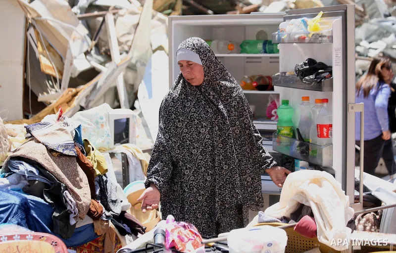 A Palestinian woman serch ther rubbles of her house after demolish by Israeli municipality bulldozers under the pretext of building without permit, at Jabal al-Mukaber district, East Jerusalem May 14, 2014. Israel destro...