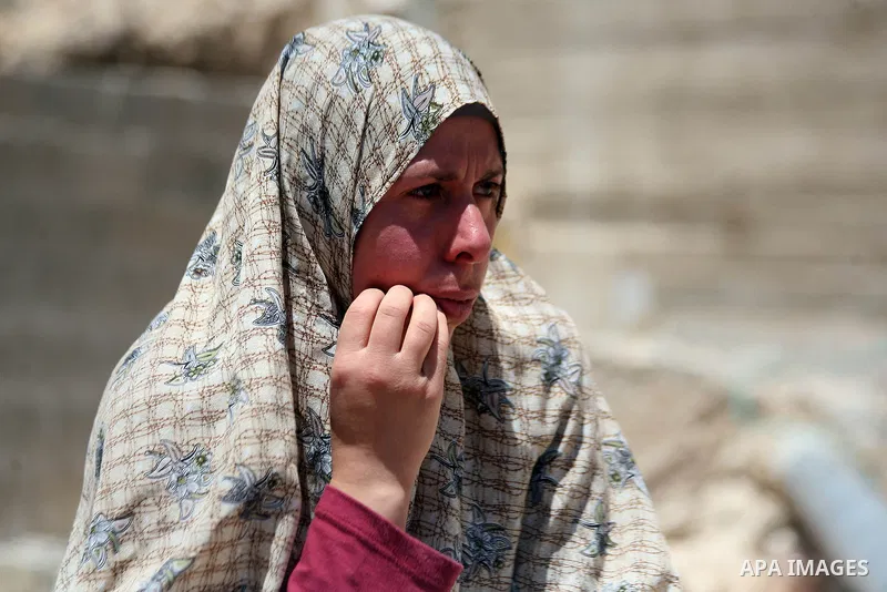 A Palestinian woman reacts after demolish her house by Israeli municipality bulldozers under the pretext of building without permit, at Jabal al-Mukaber district, East Jerusalem May 14, 2014. Israel destroyed more than 5...