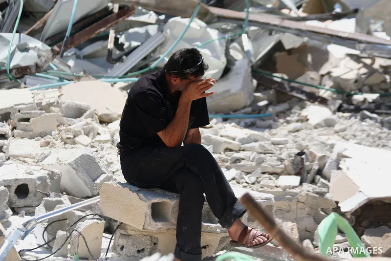 A Palestinian man sets on the rubbles of his house after demolish by Israeli municipality bulldozers under the pretext of building without permit, at Jabal al-Mukaber district, East Jerusalem May 14, 2014. Israel destroy...