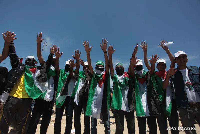 Palestinian protesters take part in a rally marking the Nakba or the ''Day of Catastrophe'' near Erez crossing in the northern Gaza Strip on May 15, 2014. Palestinians marked "Nakba" (Catastrophe) on Thursday to commemor...