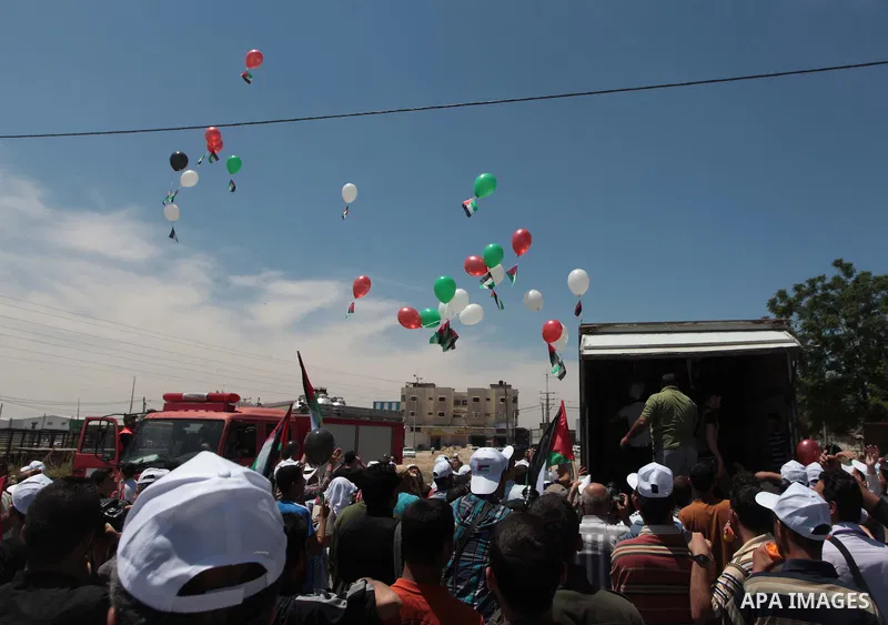 Palestinian protesters take part in a rally marking the Nakba or the ''Day of Catastrophe'' near Erez crossing in the northern Gaza Strip on May 15, 2014. Palestinians marked "Nakba" (Catastrophe) on Thursday to commemor...