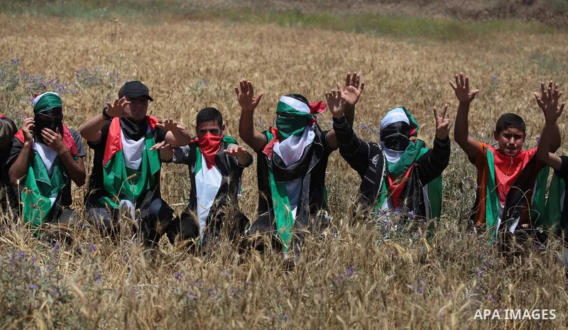 Palestinian protesters take part in a rally marking the Nakba or the ''Day of Catastrophe'' near Erez crossing in the northern Gaza Strip on May 15, 2014. Palestinians marked "Nakba" (Catastrophe) on Thursday to commemor...