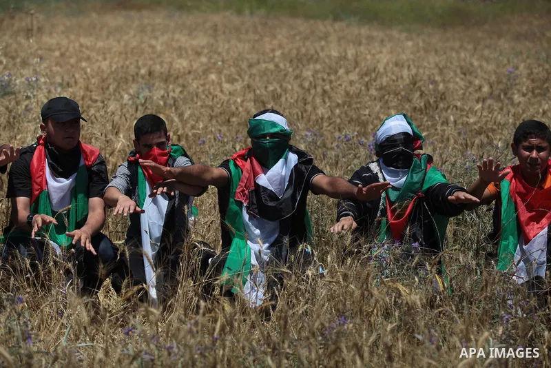 Palestinian protesters take part in a rally marking the Nakba or the ''Day of Catastrophe'' near Erez crossing in the northern Gaza Strip on May 15, 2014. Palestinians marked "Nakba" (Catastrophe) on Thursday to commemor...