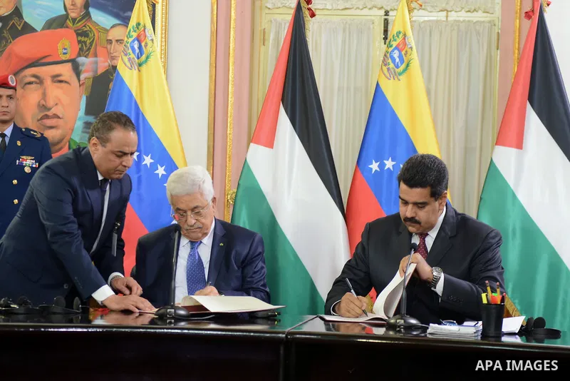 Venezuelan President, Nicolas Maduro, recieves from Palestine President, Mahmud Abbas the Palestine Star, maximun recognition that gives his country, in Miraflores Palace, in Caracas, Venezuela, on May 16, 2014. Mahmud A...
