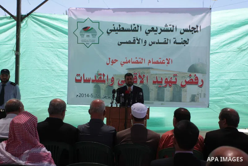 Palestinian Deputy, Ahmed Abu Halabiyeh speaks during a press conference during a protest to against the Judaization of Al-Aqsa at the Legislative Council in Gaza City on May 18, 2014. Photo by Ashraf Amra