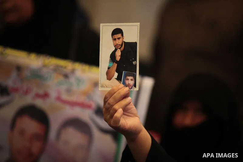 Palestinians attend a weekly protest at the Red Cross office in Gaza City on May 19, 2014, to express solidarity with Palestinian prisoners on hunger strike in Israeli jails. In late March, Israel had refused to release...