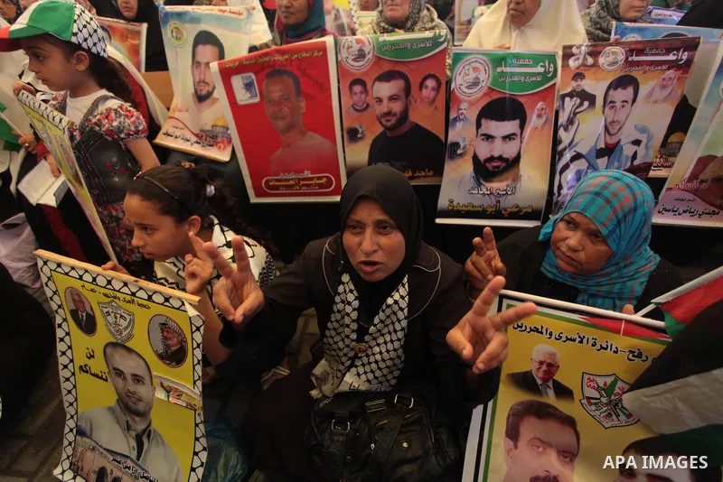 Palestinians attend a weekly protest at the Red Cross office in Gaza City on May 19, 2014, to express solidarity with Palestinian prisoners on hunger strike in Israeli jails. In late March, Israel had refused to release...