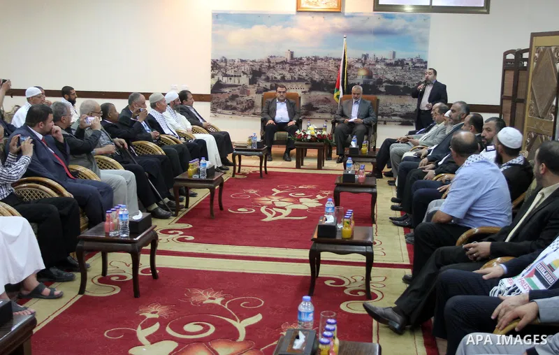 Palestinian Prime Minister in Gaza Strip Ismail Haniyah meets with the aid convoy of "Miles of Smiles 27" at his office in Gaza city May 19, 2014. Photo by Mohammed Asad