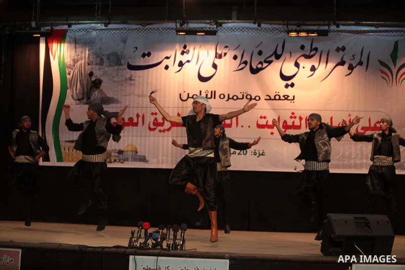 Palestinian dancers perform during the eighth National conference to maintain the Palestinian rights and constants, in Gaza City on May, 20, 2014. Photo by Ashraf Amra