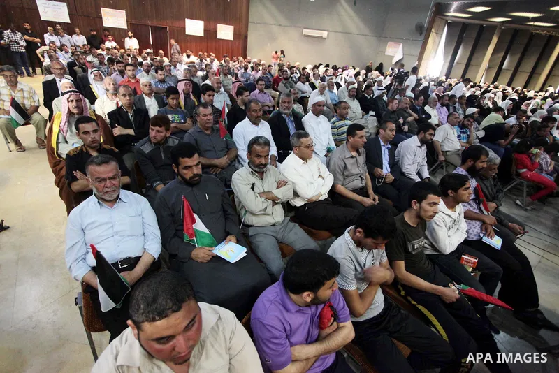 Palestinians attend the eighth National conference to maintain the Palestinian rights and constants, in Gaza City on May, 20, 2014. Photo by Ashraf Amra