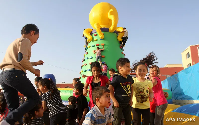 Palestinian children play on huge inflatable toys at Aqua Park, in Gaza City May 22, 2014. Photo by Mohammed Asad