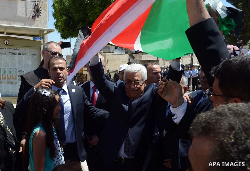 Palestinian President Mahmoud Abbas attends an open-air mass led by Pope Francis (not pictured), in the Manger Square, next the Nativity Church, in the West Bank city of Bethlehem, 25 May 2014. Pope Francis arrived in th...