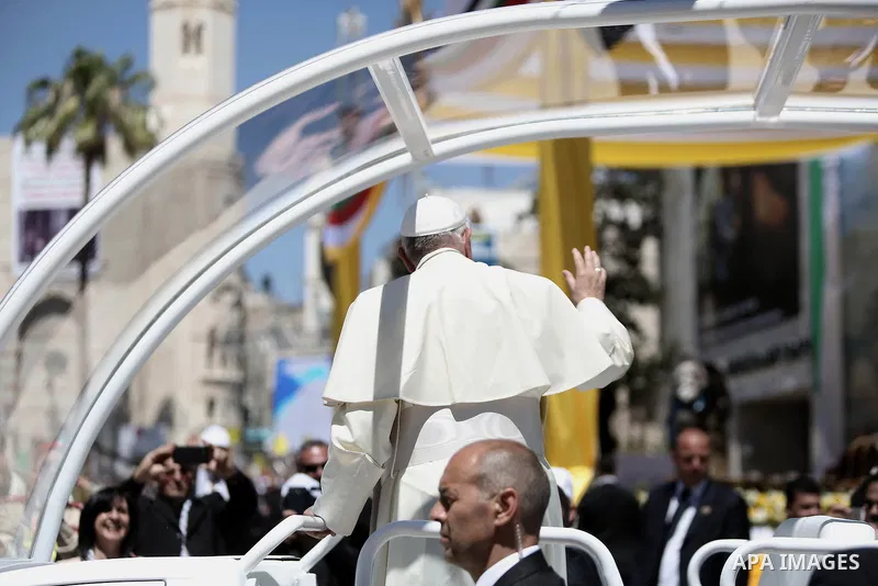 Pope Francis attends an open-air mass in the Manger Square, next to the Nativity Church in the West Bank town of Bethlehem May 25, 2014. Pope Francis made an impassioned plea for peace on a pilgrimage on Sunday to Bethle...