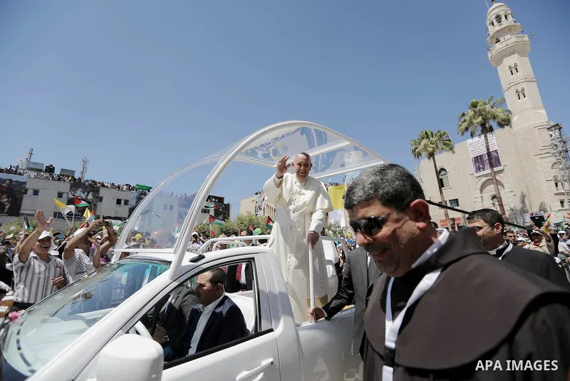 Pope Francis attends an open-air mass in the Manger Square, next to the Nativity Church in the West Bank town of Bethlehem May 25, 2014. Pope Francis made an impassioned plea for peace on a pilgrimage on Sunday to Bethle...