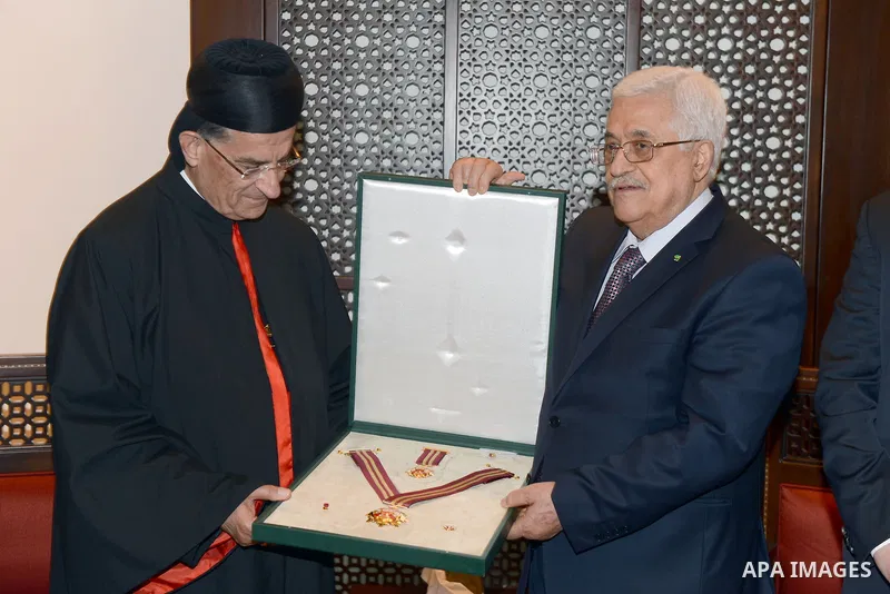 Palestinian President Mahmoud Abbas honors the Patriarch Cardinal Mar Bechara Boutros al-Rahi, in the West Bank City of Bethlehem, May 25, 2014. Photo by Thaer Ganaim