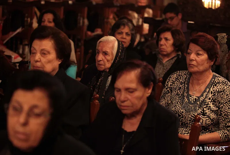 Palestinian Orthodox Christians attend Palm Sunday mass at the Saint Porfirios church in Gaza City May25, 2014. Pope Francis on Sunday invited the Israeli and Palestinian presidents to come to the Vatican to pray for pea...