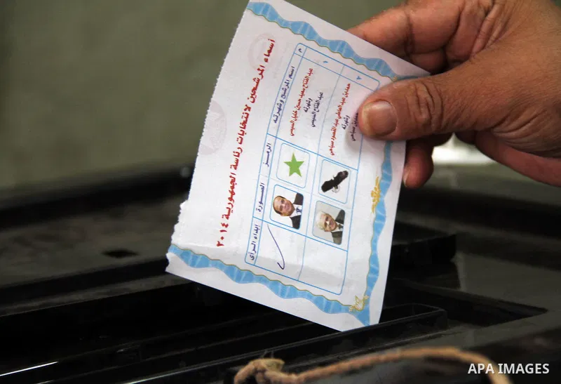 A Egyptian man casts his vote at a polling station in Cairo on May 26, 2014. Egyptians begin voting in a new presidential election which ex-army chief Abdel Fattah al-Sisi, who ousted the elected Islamist leader, is expe...