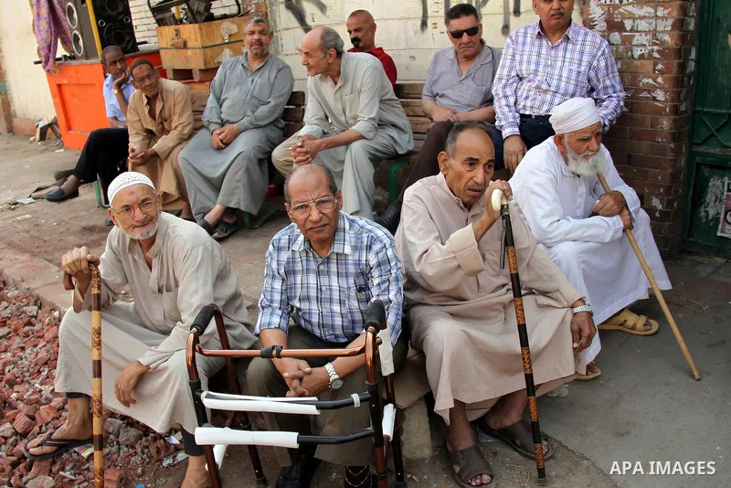 Egyptians queue outside a polling station in Cairo on May 26, 2014. Egyptians begin voting in a new presidential election which ex-army chief Abdel Fattah al-Sisi, who ousted the elected Islamist leader, is expected to e...