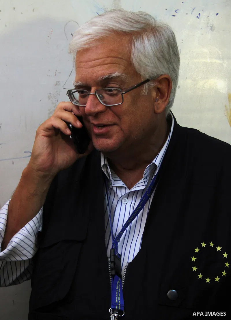 Mario David, a member of the European Parliament, and chief observer of the European Union election observation mission in Egypt visits a polling site during the first day of voting in the presidential election in Cairo,...