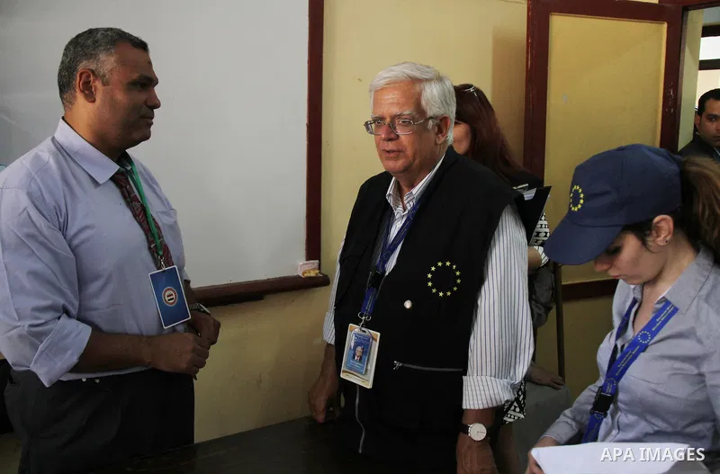 Mario David, a member of the European Parliament, and chief observer of the European Union election observation mission in Egypt visits a polling site during the first day of voting in the presidential election in Cairo,...