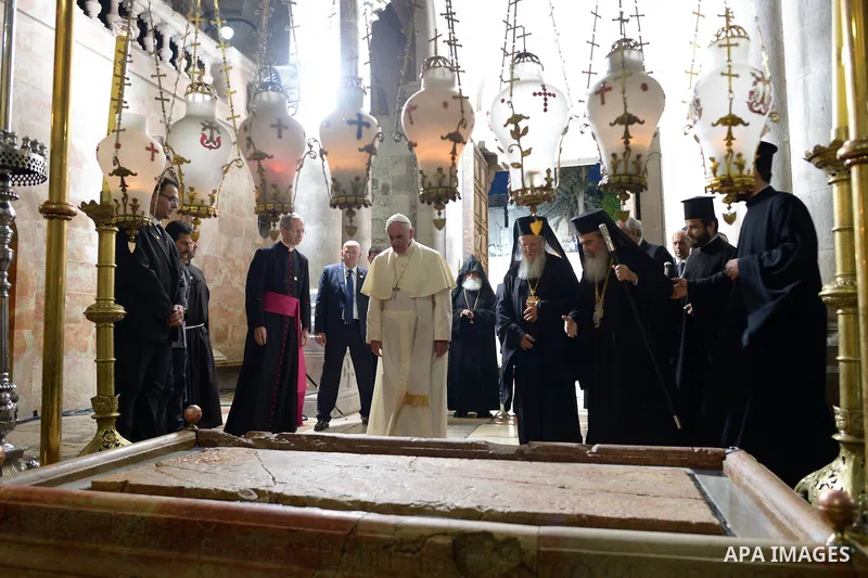 Pope Francis prays at the Church of the Holy Sepulchre in the Old City of Jerusalem on May 25, 2014. In his first Middle East tour since his anointment in 2013, Pope Francis held a historic prayer service with the Ecumen...