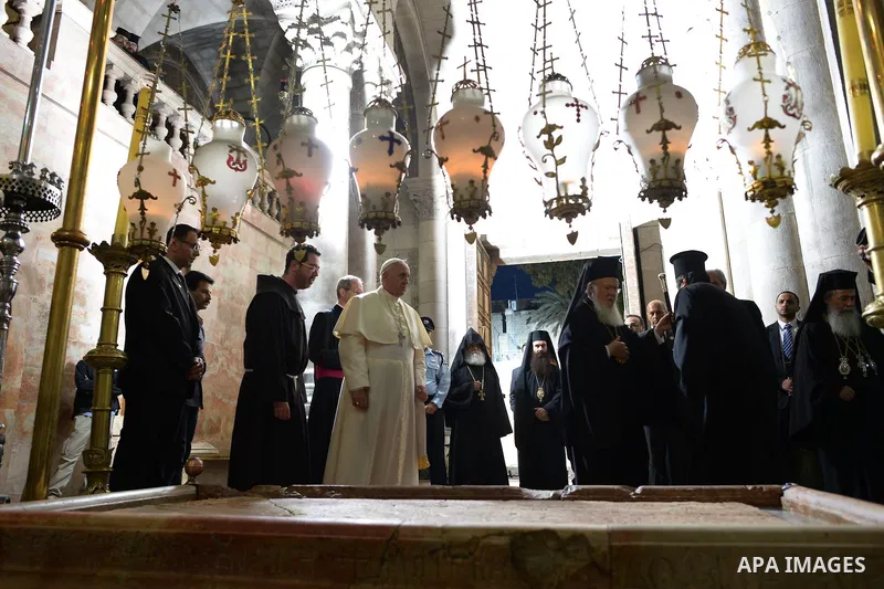 Pope Francis prays at the Church of the Holy Sepulchre in the Old City of Jerusalem on May 25, 2014. In his first Middle East tour since his anointment in 2013, Pope Francis held a historic prayer service with the Ecumen...