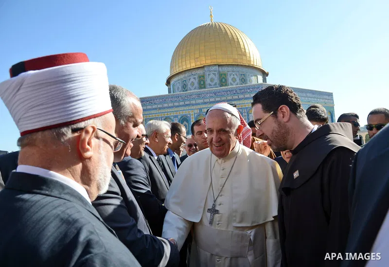 Pope Francis walks in front of the Dome of the Rock as he visits the Al-Aqsa Mosque compound, in Jerusalem's Old City on May 25, 2014. In his first Middle East tour since his anointment in 2013, Pope Francis held a histo...