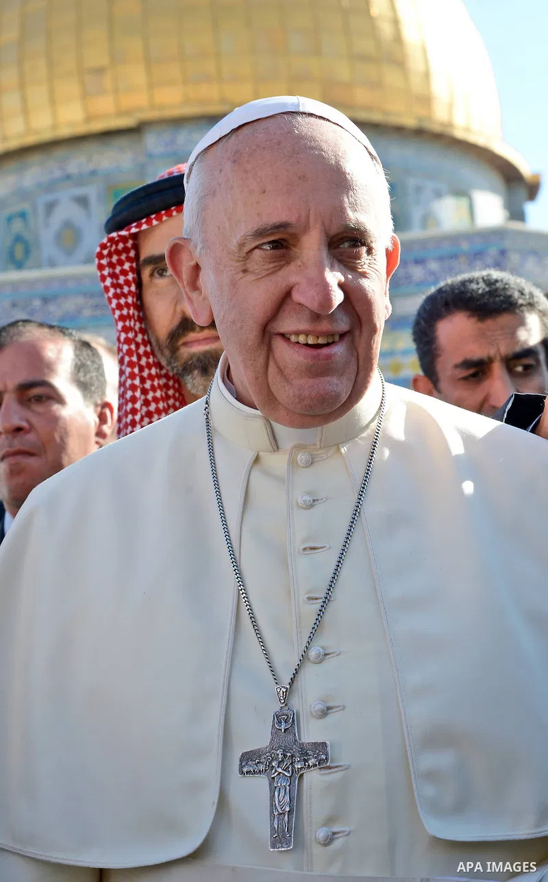 Pope Francis walks in front of the Dome of the Rock as he visits the Al-Aqsa Mosque compound, in Jerusalem's Old City on May 25, 2014. In his first Middle East tour since his anointment in 2013, Pope Francis held a histo...