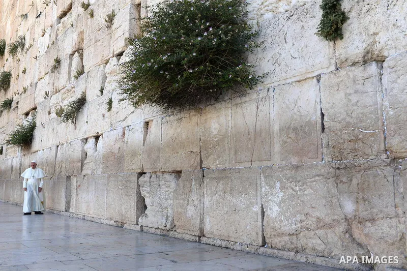 Pope Francis prays in front of the Western Wall, Judaism's holiest site, in the Old City of Jerusalem on May 26, 2014. In his first Middle East tour since his anointment in 2013, Pope Francis held a historic prayer servi...