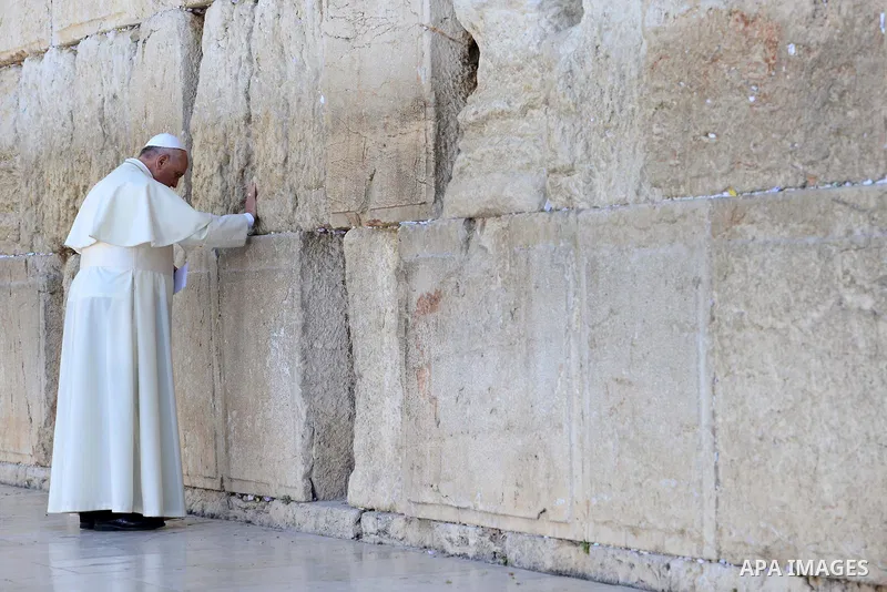 Pope Francis prays in front of the Western Wall, Judaism's holiest site, in the Old City of Jerusalem on May 26, 2014. In his first Middle East tour since his anointment in 2013, Pope Francis held a historic prayer servi...