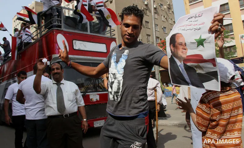 Egyptians celebrate during a rally to support Presidential candidate and former army chief Abdel Fattah al-Sisi in Cairo, May 26, 2014. Egyptians begin voting in a new presidential election which ex-army chief Abdel Fatt...