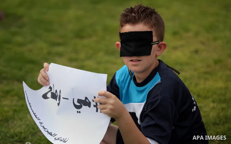 A Palestinian child takes part in a Demonstration to show solidarity with Palestinian prisoners held in Israeli jails, in Gaza city on May 28, 2014. Some 120 Palestinians jailed without trial in Israel have been on an op...