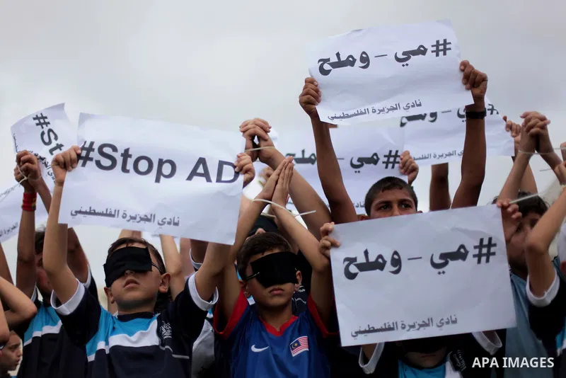 Palestinian children hold placards during a Demonstration to show solidarity with Palestinian prisoners held in Israeli jails, in Gaza city on May 28, 2014. Some 120 Palestinians jailed without trial in Israel have been...