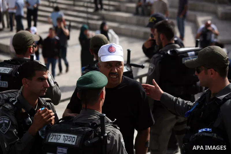 Israeli border guards prevent Palestinians from gathering in Jerusalem's Old City as Ultra-nationalist Israelis take part in the "flag march" through Damascus Gate in east Jerusalem on May 28, 2014 celebrating the annive...