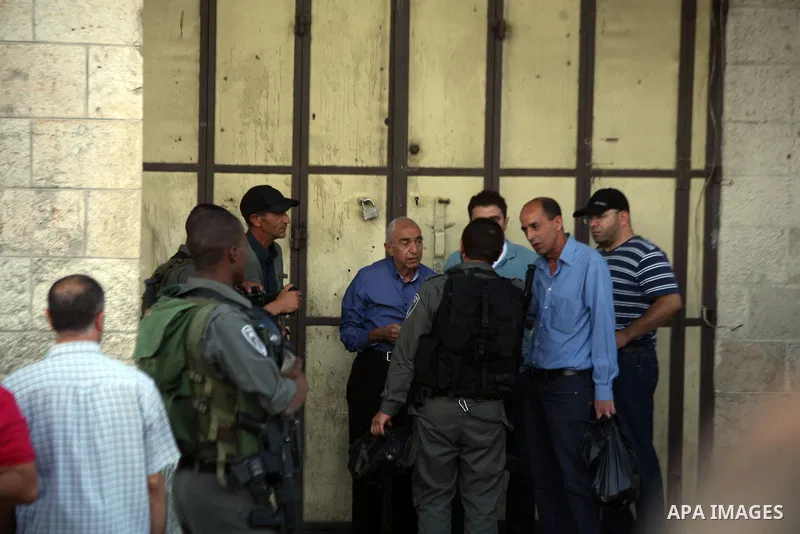 Israeli border guards detain Palestinians as Ultra-nationalist Israelis take part in the "flag march" through Damascus Gate in east Jerusalem on May 28, 2014 celebrating the anniversary of its capture in the 1967 Six-Day...