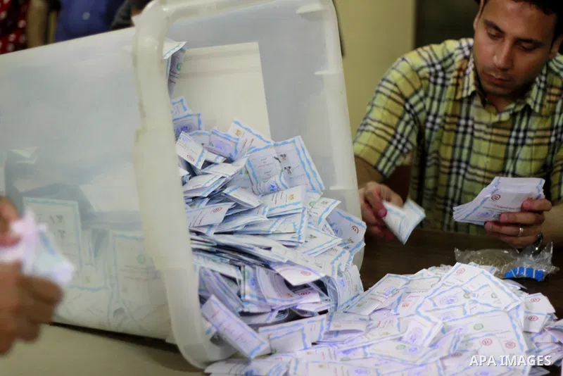Egyptian election workers count ballots at the end of the third day of voting in the presidential elections, at a polling station in Cairo, Egypt, 28 May 2014. Polling stations opened on 28 May for the final day of the v...