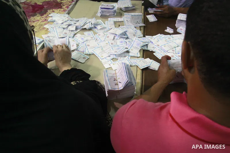 Egyptian election workers count ballots at the end of the third day of voting in the presidential elections, at a polling station in Cairo, Egypt, 28 May 2014. Polling stations opened on 28 May for the final day of the v...