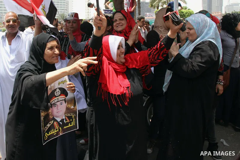 Egyptian supporters of Abdel Fattah al-Sisi celebrate at Tahrir square in Cairo May 29, 2014. Initial poll count on Wednesday showed that Egypt's former military chief Abdel Fattah al-Sisi would get a landslide victory i...