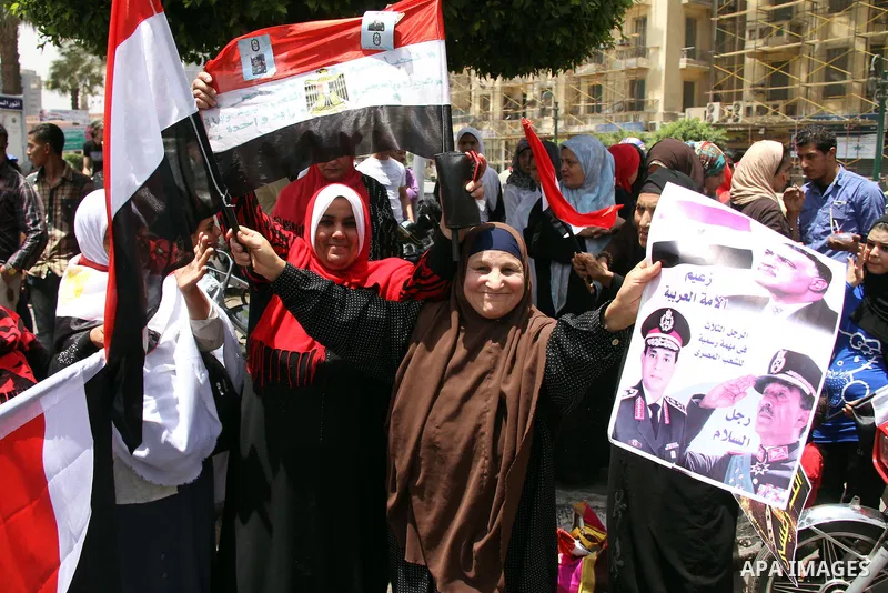 Egyptian supporters of Abdel Fattah al-Sisi celebrate at Tahrir square in Cairo May 29, 2014. Initial poll count on Wednesday showed that Egypt's former military chief Abdel Fattah al-Sisi would get a landslide victory i...