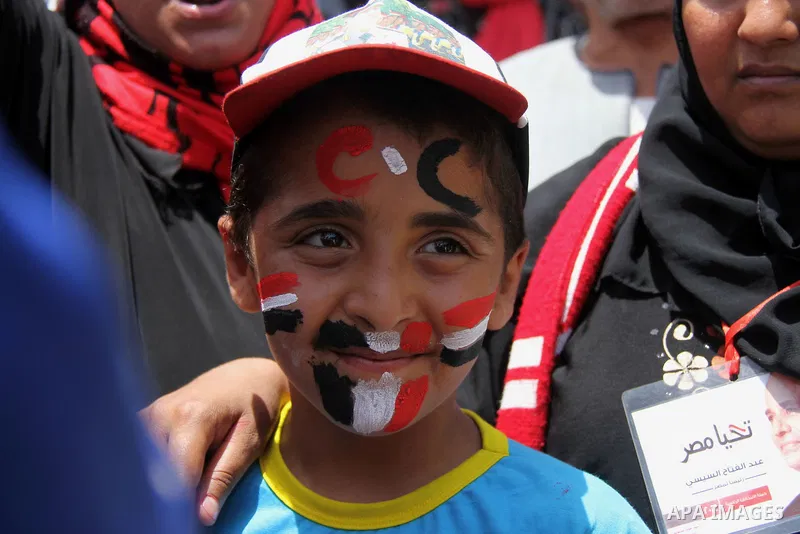 Egyptian supporters of Abdel Fattah al-Sisi celebrate at Tahrir square in Cairo May 29, 2014. Initial poll count on Wednesday showed that Egypt's former military chief Abdel Fattah al-Sisi would get a landslide victory i...