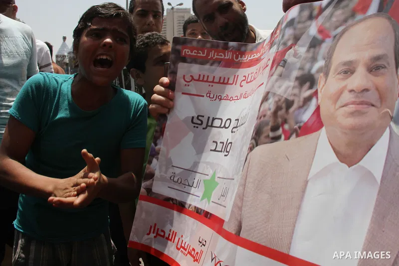 Egyptian supporters of Abdel Fattah al-Sisi celebrate at Tahrir square in Cairo May 29, 2014. Initial poll count on Wednesday showed that Egypt's former military chief Abdel Fattah al-Sisi would get a landslide victory i...