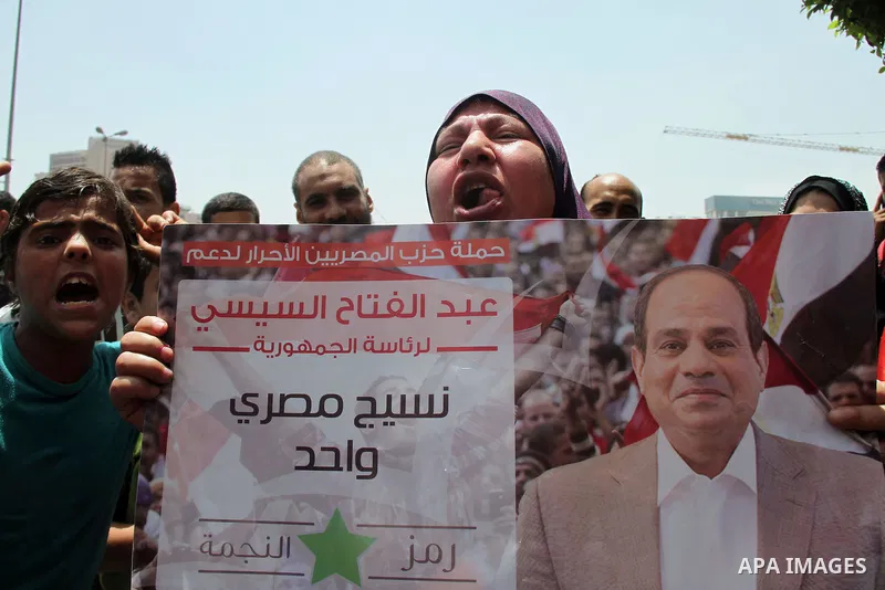 Egyptian supporters of Abdel Fattah al-Sisi celebrate at Tahrir square in Cairo May 29, 2014. Initial poll count on Wednesday showed that Egypt's former military chief Abdel Fattah al-Sisi would get a landslide victory i...